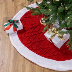 a christmas tree skirt with presents under it