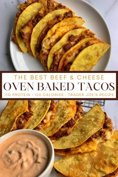 the best beef and cheese oven baked tacos are on a plate with dipping sauce