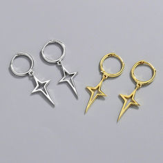 These earrings embody a delicate balance between modern charm and timeless allure, showcasing intricately crafted hollow star pendants that gracefully dangle and capture the light. Brown One Piece, Solid Necklace, Stars Earrings, Silver Gold Earrings, Purple One Piece, Silver Star Earrings, Short Dress Styles, Silver Style, Fashion Pattern