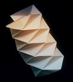 an origami sculpture is shown against a black background in this image it appears to be folded paper