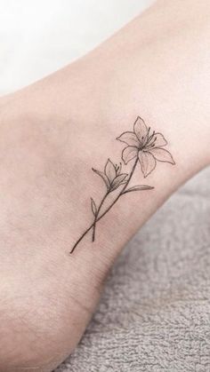 a small flower tattoo on the ankle is one of the most popular tattoos for women