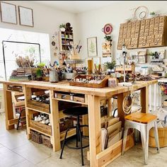 a room filled with lots of different types of crafting supplies on tables and chairs