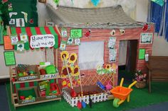 a doll house made to look like a child's play area with toys and decorations