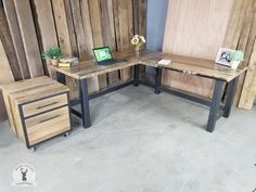 two desks made out of wood and metal are sitting next to each other on the floor