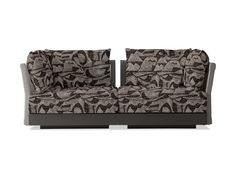 a couch that is sitting on top of a wooden frame and has a patterned design