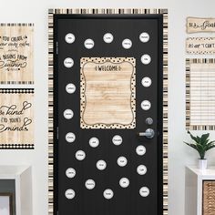 a welcome door is decorated with black and white polka dots