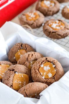 chocolate cookies with caramel filling in a baking pan