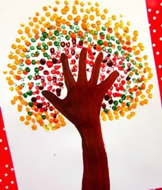 an art project for kids to do with their hands and the tree is made out of candy