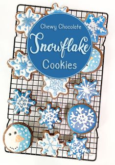 some cookies are on a cooling rack with the words snowflake cookies above them