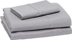 the sheets are folded and ready to be used in this bedding set, which is light gray