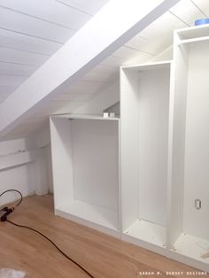 an empty room with some shelves in it