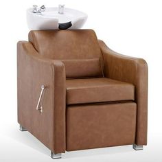 a brown chair with a sink on top of it's backrest and legs