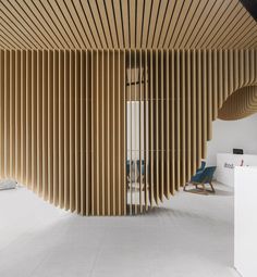 an office with wooden slats covering the walls