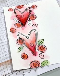 a piece of paper that has been drawn with watercolors and is next to a ruler