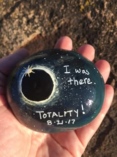 a hand holding a rock with the words i was there totality 8 11 17