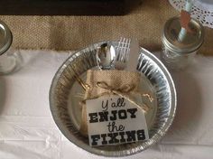 a silver plate topped with a napkin and fork