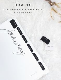 the binder tabs are sitting next to some scissors and other items on a white furnishing