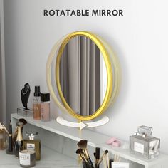 a mirror sitting on top of a white shelf