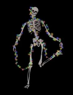 a skeleton with multicolored lights on it's body