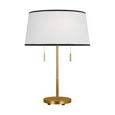 a gold table lamp with a white shade on the base and a black drum light