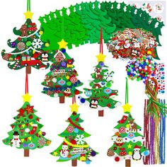 christmas tree decorations are hanging from strings on a white background with other ornaments in the shape of trees