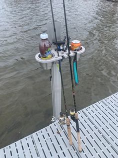 two fishing rods are hooked up to the dock