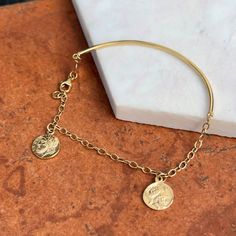 14KT yellow gold half bangle, half faux roman coin charm bracelet. One side a hollow bangle, and other side is detailed finished, double sided Roman coins on open link chain. Measures 7” Around Width: 1.7 mm~2.5mm Coins: 11mm Fancy lobster clasp Can be clasped shorter if needed Hollow bangle Weight: 5 grams Finished on all sides Stamped 14K Coin Charm Bracelet, Coin Bracelet, Roman Coins, White Gold Bracelet, Stacked Bangles, Bangle Bracelets With Charms, Back Jewelry, White Gold Necklaces, White Gold Earrings