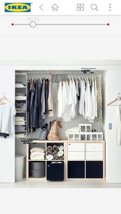 an open closet with clothes on hangers