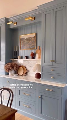 an image of a kitchen setting with blue cabinets