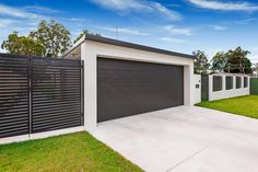 a house with a large garage in the front yard