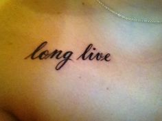 a woman's chest with the words long live written on it