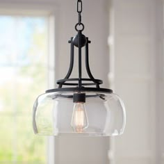 a light fixture hanging from a ceiling in a kitchen