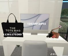 the tote bag is on display in front of a computer screen