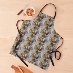 an apron with the image of a woman eating eggs