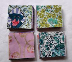 four different colored papers with designs on them