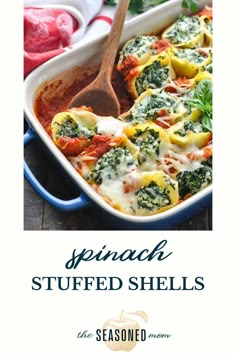 spinach stuffed shells in a blue casserole dish