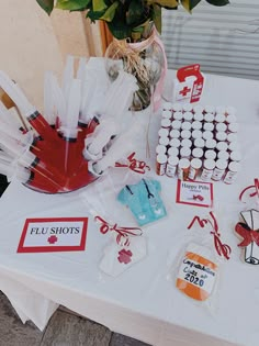 a table topped with lots of cupcakes and candy