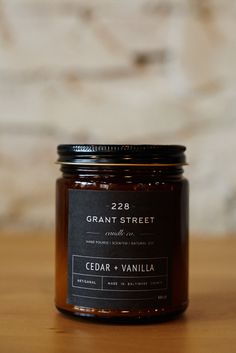 a candle sitting on top of a wooden table