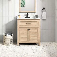 a bathroom with a sink, mirror and towel rack on the wall next to it