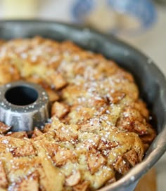 a cake in a pan with powdered sugar on top