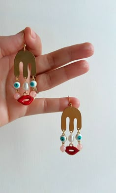 In-stock! The Madame Lu earring is just the right mix of funny and chic to make any outfit unique. These are made with different materials such as raw brass, freshwater pearl, acrylic beads, and with hypoallergenic stainless steel hooks. Size: Length: 2.5in Height: 0.75in Fun Earrings Unique, Artistic Earrings, Funny Earrings, Unusual Earrings, Face Earrings, Dope Jewelry, Earrings Inspiration, Funky Jewelry, April 29