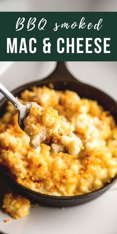 macaroni and cheese in a cast iron skillet with a spoon on top