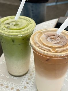 two drinks sitting next to each other on a table