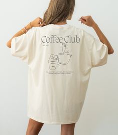 Our T-shirt is a must-have for every member of the Coffee Club team. ♡ Embrace the perfect blend of style and comfort while showcasing your passion for the brew that fuels your day. Ideal for coffee lovers who want to wear their enthusiasm with pride! If you have any special requests or unique ideas, please don't hesitate to contact us. ADDITIONAL DETAILS: ♡ Made from 100% cotton. Perfect for casual wear and everyday wear. ♡ Fabric weight: 170 - 180 g/m² ♡ Neck and shoulder tape ♡ Double seam on Coffee Merchandise Ideas, Coffee Shirt Ideas, Coffee Shop Merch, Coffee Shop Shirt, Coffee Merch, Coffee Shop Branding, Coffee Tees, Coffee Club, Local Coffee Shop