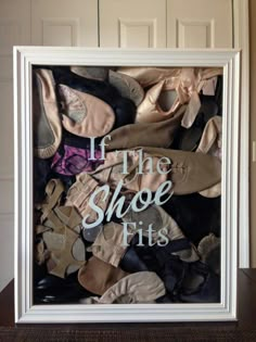 a white frame filled with lots of shoes