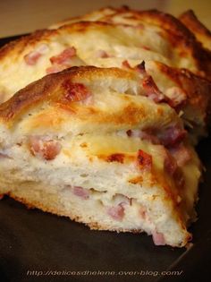 two pieces of bread with cheese and ham on them