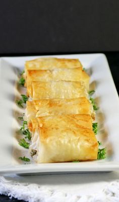 a white plate topped with food on top of a table