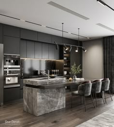 a modern kitchen with marble counter tops and stainless steel appliances