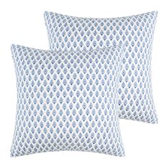 two blue and white pillows on a white background