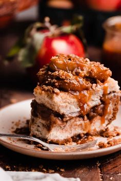 a piece of cake sitting on top of a white plate with a fork in it